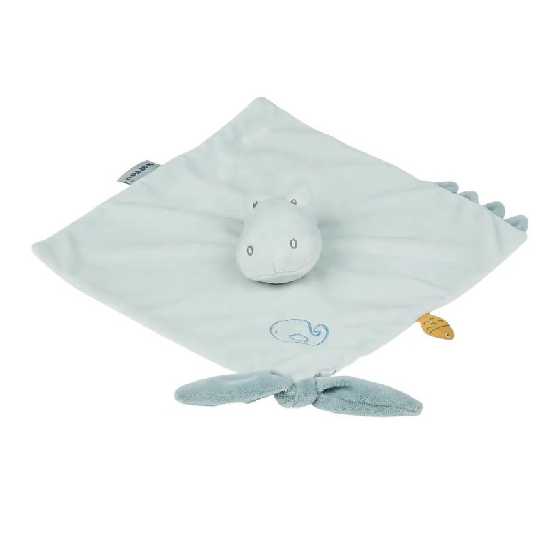 Hellblaue Baby-Kuscheldecke mit Dinosaurierkopf und -schwanz sowie einem kleinen Walmotiv auf dem Stoff. Hellblaue Baby-Kuscheldecke mit Dinosaurierkopf und -schwanz sowie einem kleinen Walmotiv auf dem Stoff.