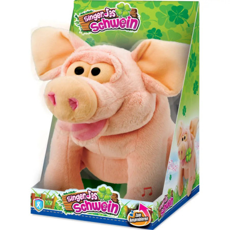 Plüschiges rosa Schwein mit großen Ohren in bunter Singer Jas Schwein Box mit Kleeblattdekor.