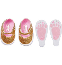 Glitzernde goldene Babyschuhe und zwei weiße Einlegesohlen mit rosa Fußabdrücken sowie Links- und Rechts-Aufschrift.