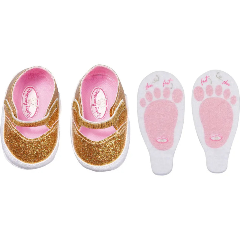 Glitzernde goldene Babyschuhe und zwei weiße Einlegesohlen mit rosa Fußabdrücken sowie Links- und Rechts-Aufschrift.