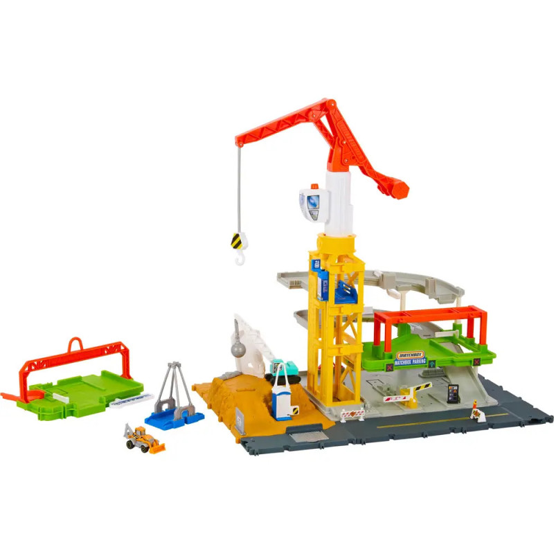 Baukasten mit Kran, Schienen, Fahrzeugen und Zubehör auf grauer Grundplatte. Baukasten mit Kran, Schienen, Fahrzeugen und Zubehör auf grauer Grundplatte.