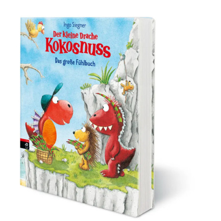Buntes Kinderbuchcover: Zwei Cartoon-Drachen und ein Igel stehen auf Gras vor einer Felswand, darüber ein Vogel.