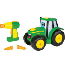Grüner Spielzeugtraktor mit Kulleraugen, Spielzeugbohrer und zwei gelb-grünen Bolzen.