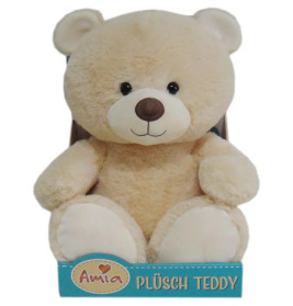 Beiger Plüsch-Teddy mit rundem Gesicht in blauer Box mit der Aufschrift Amia Plüsch Teddy.
