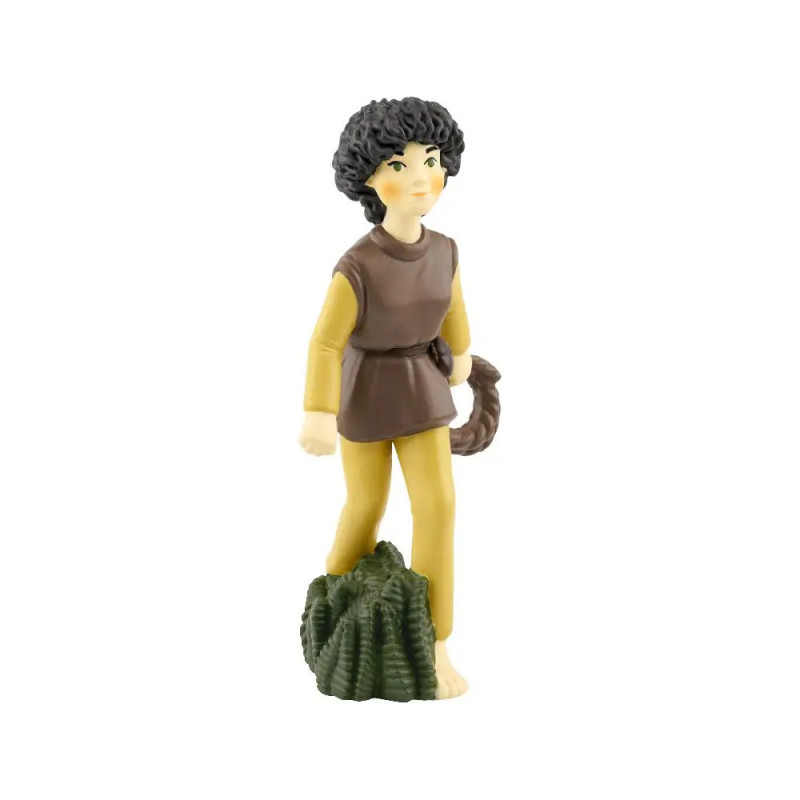 Plastikfigur einer Person mit Locken, gelber Hose, brauner Tunika auf grün strukturiertem Untergrund. Plastikfigur einer Person mit Locken, gelber Hose, brauner Tunika auf grün strukturiertem Untergrund.