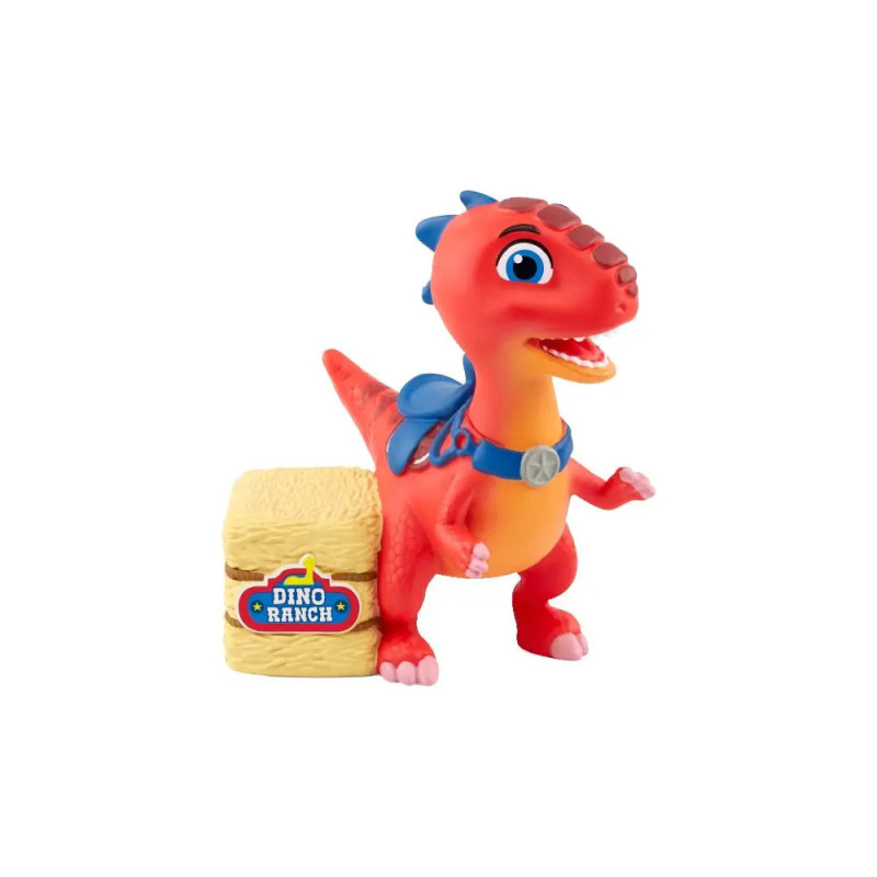 Rotes Dino-Spielzeug mit blauen Akzenten neben Heuballen mit Dino Ranch-Aufschrift vor weißem Hintergrund.