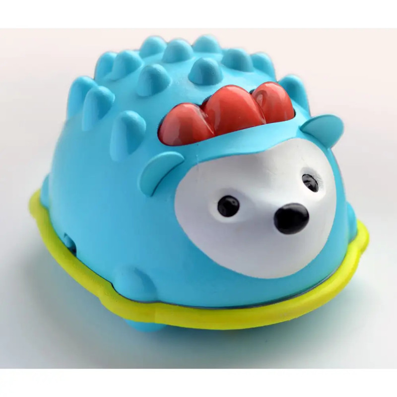 Blauer Spielzeugigel mit roten Stacheln, weißem Gesicht, schwarzen Augen und gelbem Ring um den Körper.