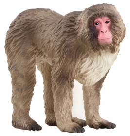 Ein realistisches Affenmodell mit braunem Fell und rosa Gesicht steht auf allen vieren.