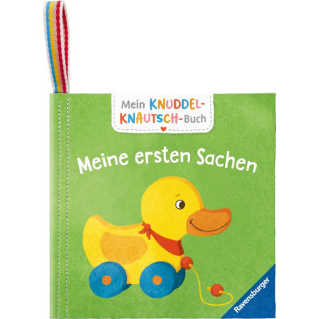 Grünes Babybuch mit einer gelben Spielzeugente auf Rädern und dem Titel Meine ersten Sachen.