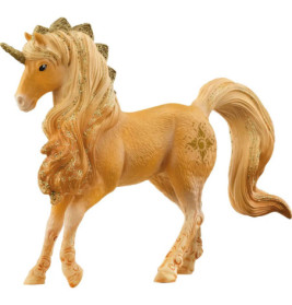 Goldene Einhorn-Figur mit glitzernder Mähne, Schweif und Horn, steht auf drei Beinen.