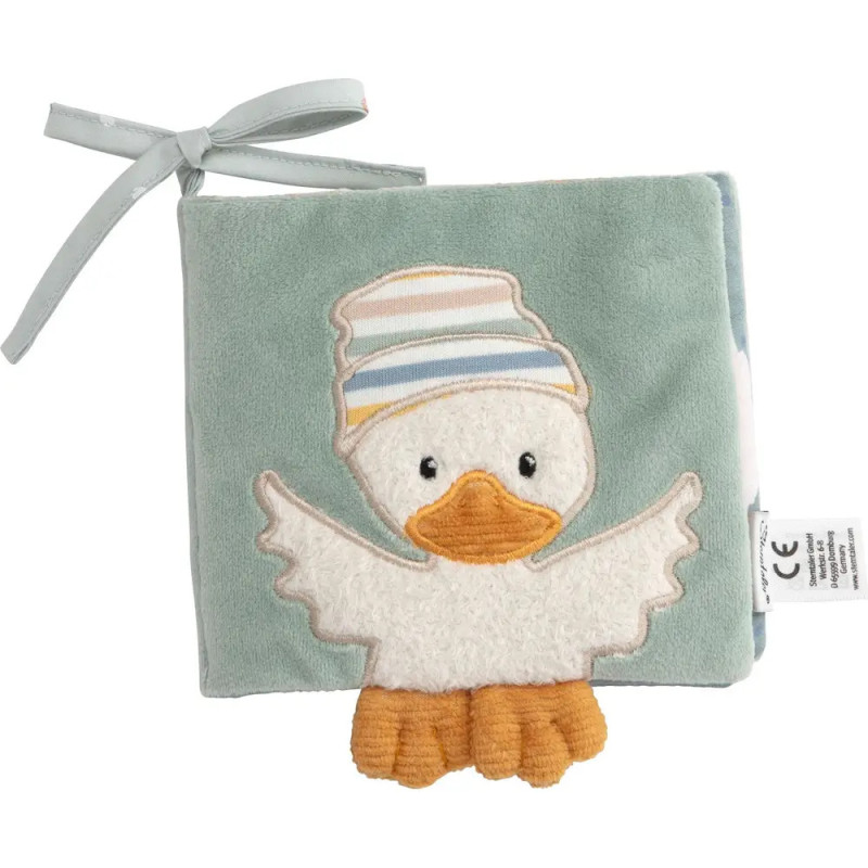 Weiches Stoff-Babybuch mit einer Ente mit gestreifter Mütze auf dem Cover und Schleife an der Ecke. Weiches Stoff-Babybuch mit einer Ente mit gestreifter Mütze auf dem Cover und Schleife an der Ecke.