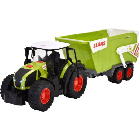 Grüner Spielzeugtraktor mit weißem Dach zieht passende grüne CLAAS-Anhänger mit roten Rädern.