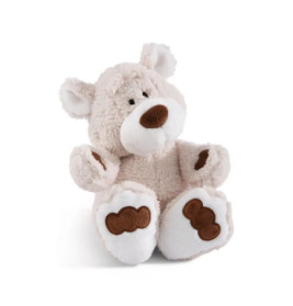 Beiger Plüsch-Teddybär mit braunen Flecken an Pfoten und Nase, sitzt aufrecht.