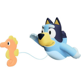 Blauer Cartoonhund fliegt und hält eine Schnur, an der ein orangener Seepferdchen-Ballon befestigt ist.
