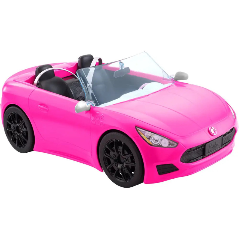 Knallpinker Spielzeug-Cabrio mit schwarzen Sitzen, Lenkrad und Rädern ähnelt einem Sportwagen. Knallpinker Spielzeug-Cabrio mit schwarzen Sitzen, Lenkrad und Rädern ähnelt einem Sportwagen.