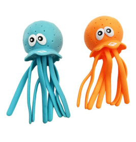 Zwei Spielzeug-Quallen, eine blau, eine orange, jeweils mit großen Comicaugen und langen Tentakeln.