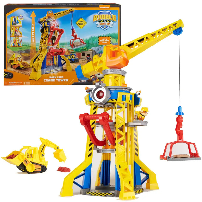 Gelb-blaues Spielzeug-Kran-Set mit Bagger, Verpackung im Hintergrund sichtbar. Gelb-blaues Spielzeug-Kran-Set mit Bagger, Verpackung im Hintergrund sichtbar.
