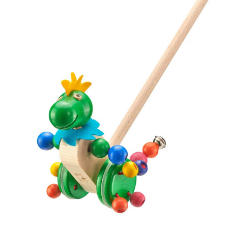 Holzschiebetier in Dinosaurierform, bunt bemalt, mit Krone, Rädern und Stielgriff.