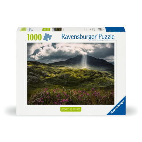 Ravensburger Puzzle mit Foto: Sonnenstrahlen über grünen Hügeln und Bergen unter dramatischen Wolken.