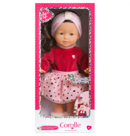 Corolle-Puppe mit Stirnband im pink-roten Outfit, präsentiert in einer pink-weißen Verpackung.