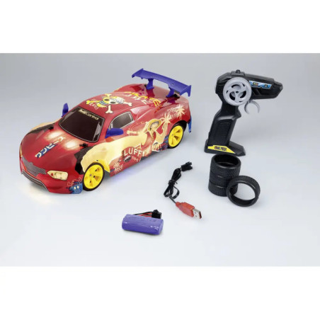 Rotes RC-Auto im Anime-Design mit Fernbedienung, Akku, Ladegerät und zwei Ersatzreifen auf weißem Hintergrund. Rotes RC-Auto im Anime-Design mit Fernbedienung, Akku, Ladegerät und zwei Ersatzreifen auf weißem Hintergrund.
