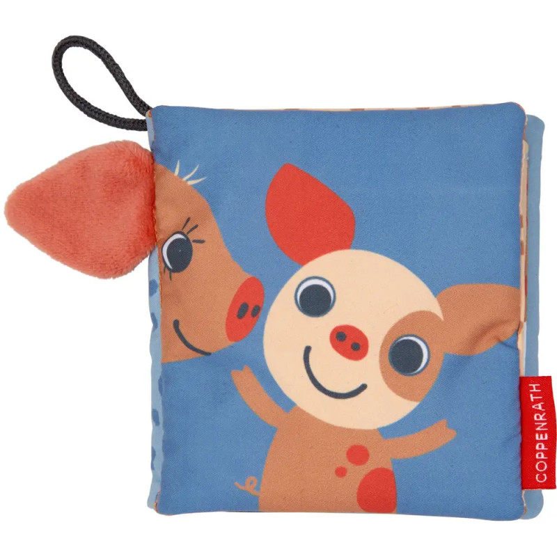 Weiches Babybuch mit Schweinchen- und Kuhmotiv auf blauem Umschlag sowie seitlichem Plüschohr.