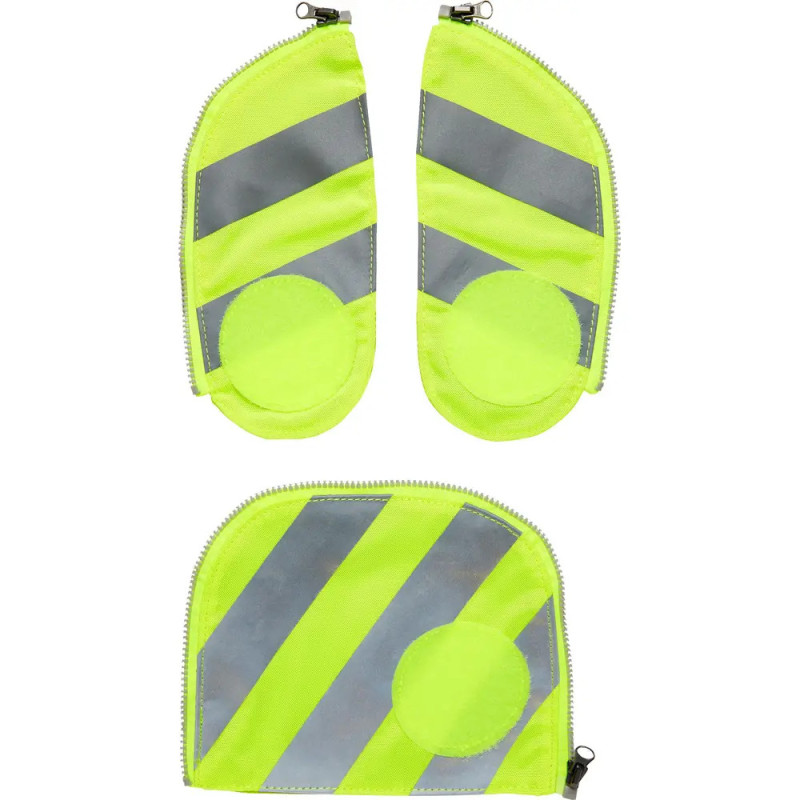 Drei neongelbe und graue reflektierende Stoffteile mit Reißverschluss (zwei oval, eins rechteckig) auf weißem Grund.