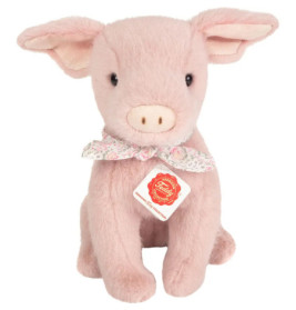 Rosa Plüschschwein mit geblümtem Schal um den Hals und einem Etikett an der Brust.