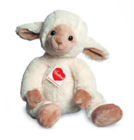 Plüsch-Lamm mit weißem Fell, braunem Gesicht und rotem Heartland-Anhänger am Hals.