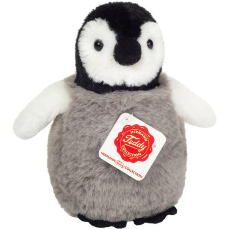 Plüsch-Pinguin mit grauem Körper, weißem Gesicht, schwarzem Schnabel und rotem Etikett Teddy Collection.