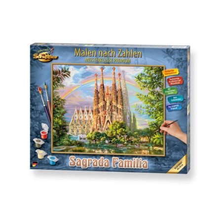 Malen-nach-Zahlen-Set mit Sagrada Familia, Farbbehältern, Pinseln und einer Hand beim Ausmalen der Vorlage.