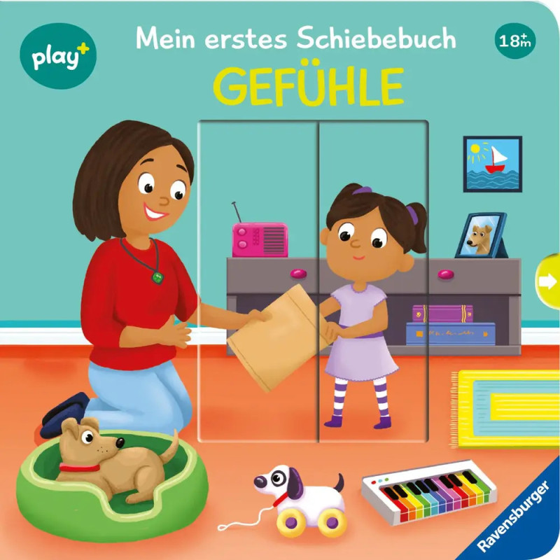 Eine Frau und ein Mädchen lächeln drinnen, Spielzeug und ein Hund sind zu sehen. Das Buch heißt Gefühle.