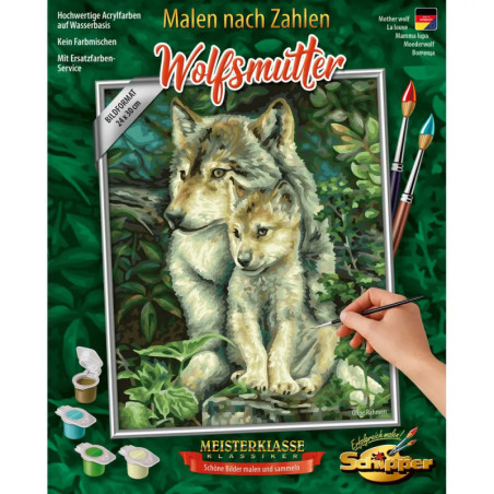Auf der Malset-Box sind Wolfsmutter und Junges im Wald zu sehen, eine Hand malt das Bild nach Zahlen aus.