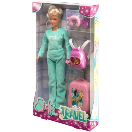 Steffi Love Reisepuppe im Karton mit türkisfarbenem Outfit, Koffer, Rucksack und Reiseaccessoires.