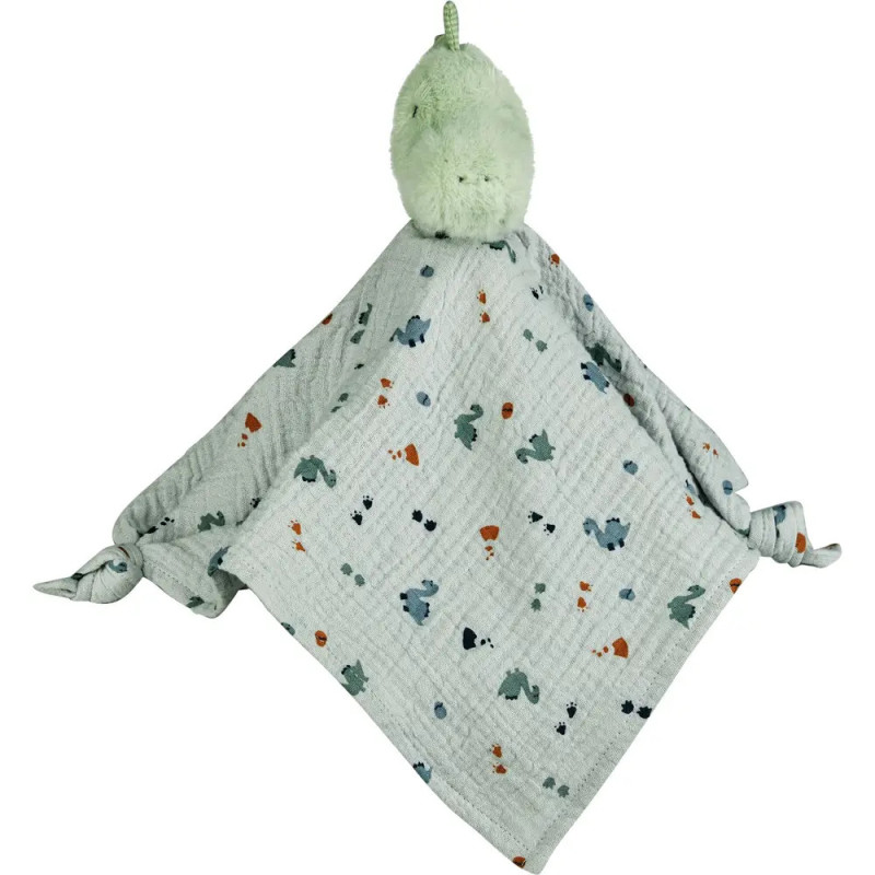 Grüner Plüsch-Dinosaurierkopf an weicher, weißer Babydecke mit Muster und geknoteten Ecken befestigt. Grüner Plüsch-Dinosaurierkopf an weicher, weißer Babydecke mit Muster und geknoteten Ecken befestigt.