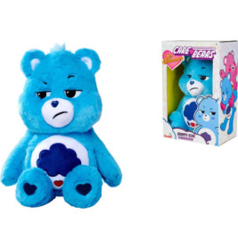 Der blaue Grumpy Bear Plüschbär aus der Care Bears-Serie vor und in seiner bunten Verpackung.
