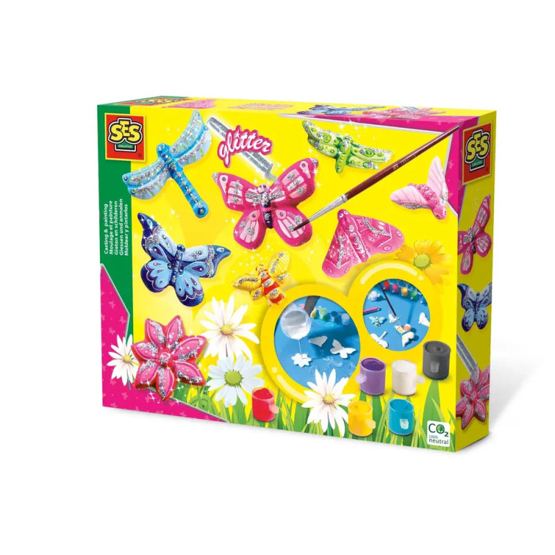 Bastelset mit Schmetterlings- und Libellenmotiven, Farben, Pinseln, Glitzer auf gelbem Blumenhintergrund. Bastelset mit Schmetterlings- und Libellenmotiven, Farben, Pinseln, Glitzer auf gelbem Blumenhintergrund.