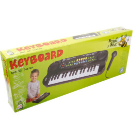 Grüne Box mit Spielzeug-Keyboard und Mikrofon, abgebildetes spielendes Kind. Marke: Boogie Bee. Ab 3 Jahren.