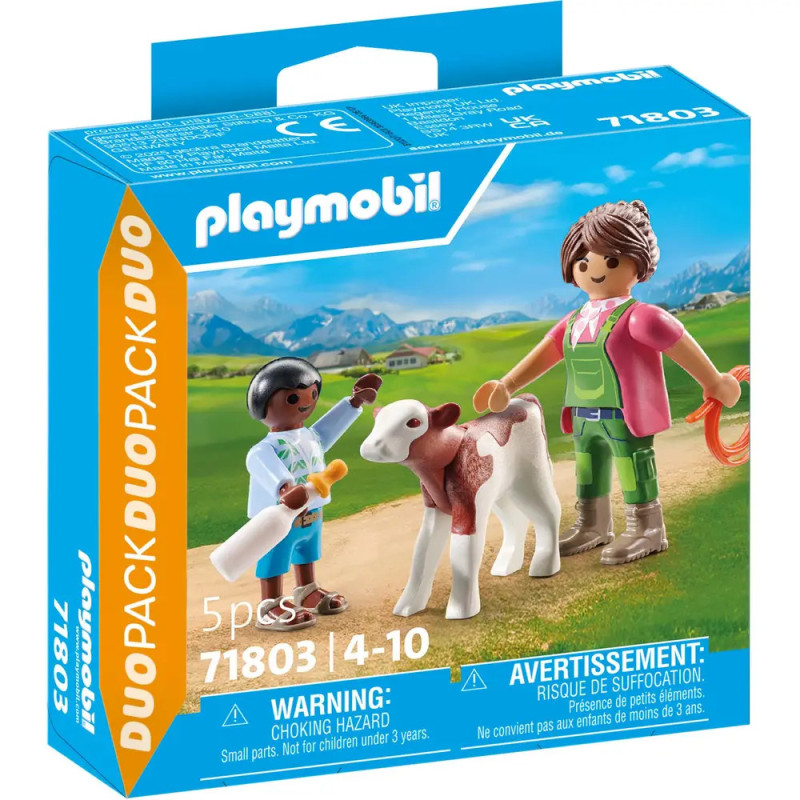 Playmobil-Set: Tierärztin und Bauer versorgen ein Kalb auf einer grünen Wiese.