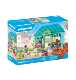 Playmobil-Set mit Gartencafé-Szene, Figuren, Pflanzen und Zubehör auf der Verpackung.