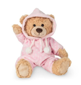 Ein brauner Teddybär im pinken Polka-Dot-Hoodie und Hose sitzt und hebt eine Pfote.