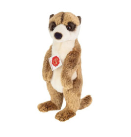 Ein Plüsch-Erdmännchen steht aufrecht und trägt ein rotes Etikett auf der Brust.