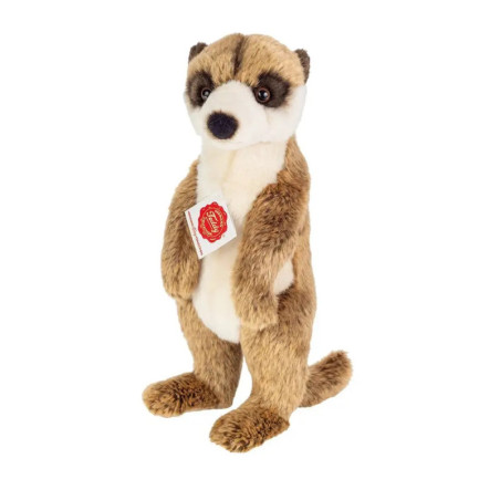 Ein Plüsch-Erdmännchen steht aufrecht und trägt ein rotes Etikett auf der Brust.