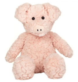 Ein flauschiges, hellrosa Stoffschwein mit schwarzen Knopfaugen sitzt aufrecht und blickt nach vorn.