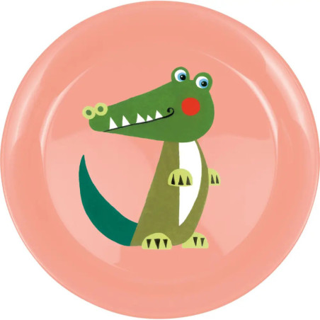 Rosa Teller mit einem grünen, lachenden Krokodil und roten Wangen im Cartoon-Stil.