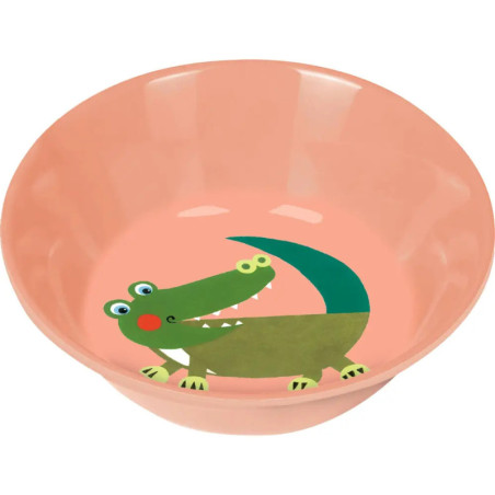 Rosa Schüssel mit gezeichnetem grünem Krokodil am inneren Boden.
