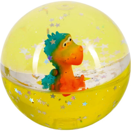 Gelber Flummi mit kleinem orange-blauen Dinosaurierfigürchen, umgeben von Sternen-Konfetti.