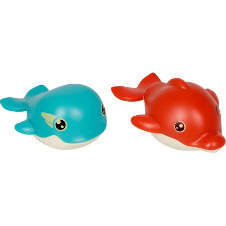 Zwei Spielzeug-Meerestiere, einer blau, einer rot, beide mit freundlichen Augen und Lächeln.