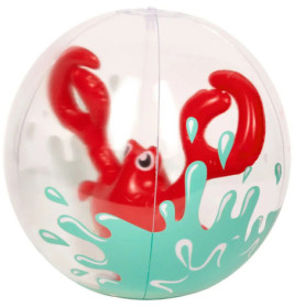 Eine rote Spielzeugkrabbe in einer transparenten Kugel mit türkisfarbenen Spritzmustern.