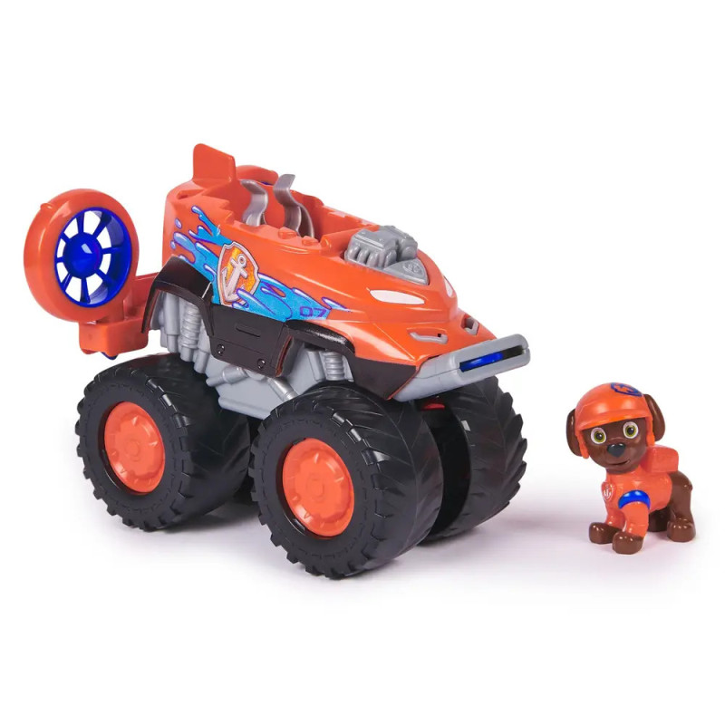 Oranger Spielzeug-Monstertruck mit blauen Mustern neben einer kleinen Hundefigur mit Helm und Weste.